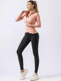 "Pink zip-up quick-dry yoga top with black leggings for women, perfect for autumn and winter gym, running, and fitness routines."