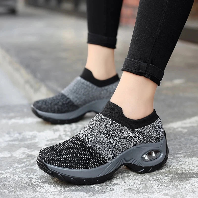 "Women Sneakers Fashion Breathable Walking Mesh Platform Shoes in black with slip-on design and cushioned sole for gym or casual wear."
