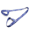 "Blue paisley patterned adjustable yoga mat strap with dual loops for secure mat holding. Ideal for yoga, Pilates, and stretching routines."
