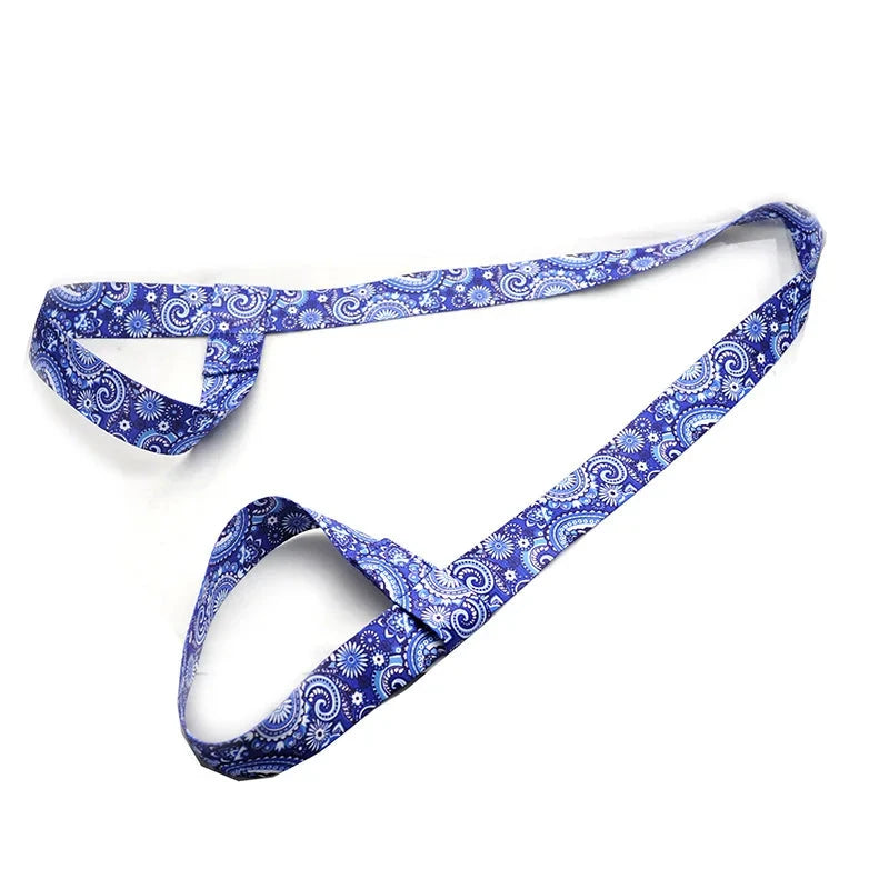"Blue paisley patterned adjustable yoga mat strap with dual loops for secure mat holding. Ideal for yoga, Pilates, and stretching routines."