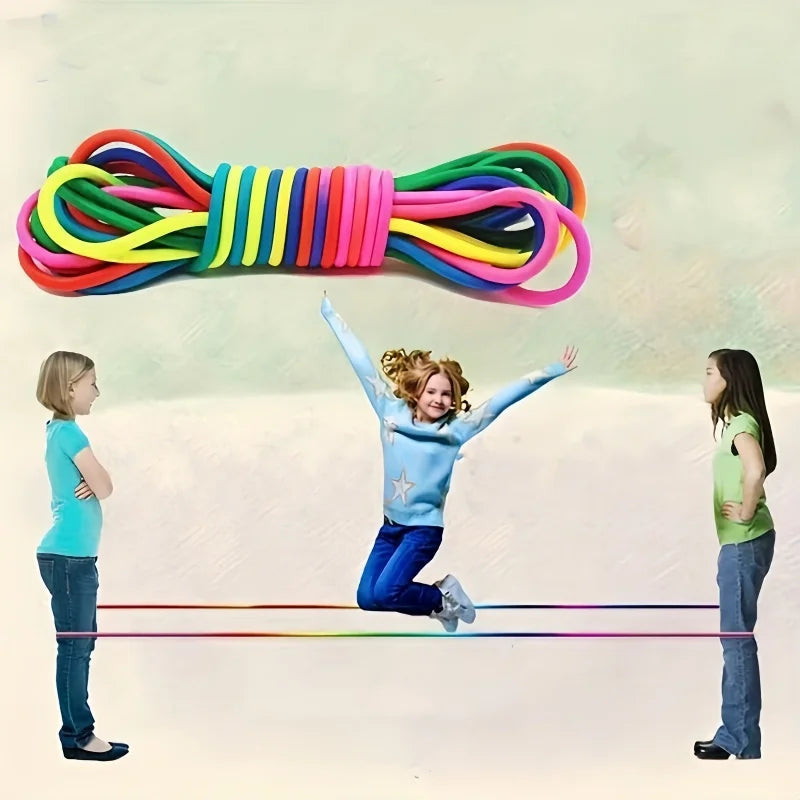 Colorful elastic band with children using it to balance on a slackline.