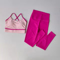 A two-piece activewear set featuring a light pink sports bra with magenta trim and matching high-waisted leggings in a vibrant magenta pink, laid flat on a light gray background.