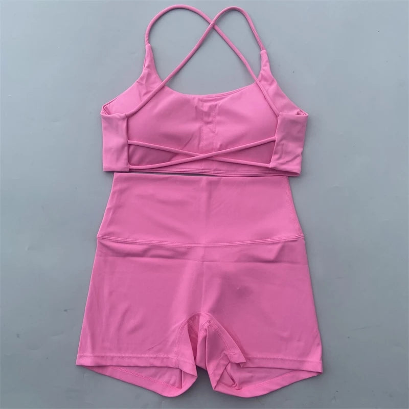 Pink two-piece outfit on a gray background