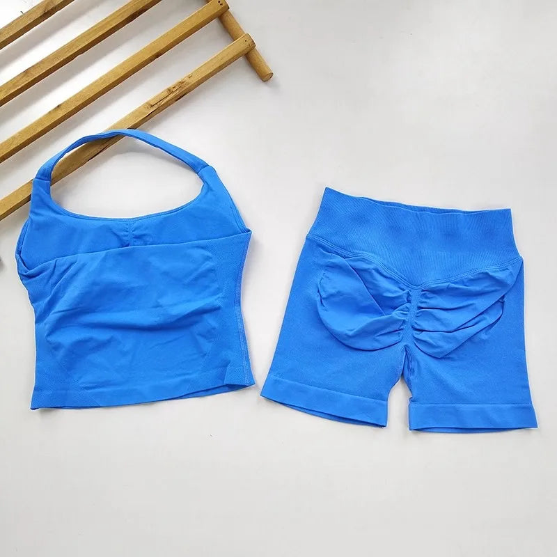 Blue crop top and shorts set on a light gray background