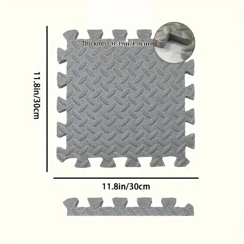 Gray interlocking foam mat with measurements and a drill bit on a white background