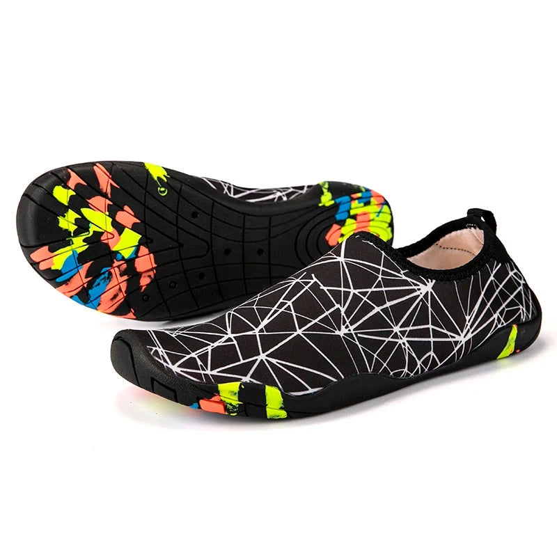 Unisex black aqua shoes with colorful sole, designed for beach and gym use, lightweight and quick-drying, slip-on style.