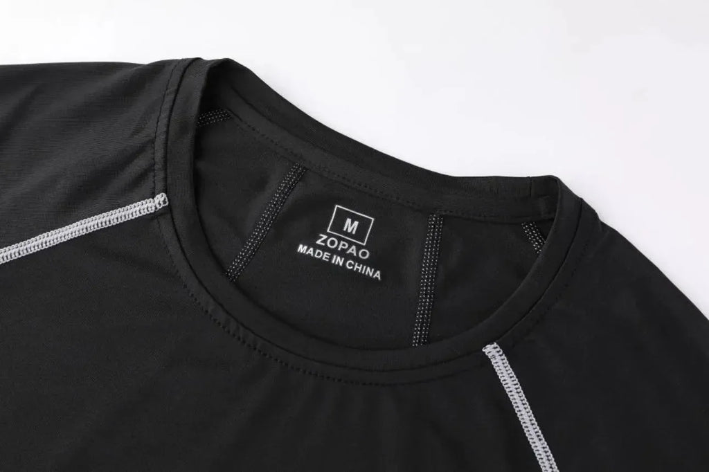Close-up of neckline on black Men Bodybuilding Sportswear Clothes Fitness Suit showing brand label and stitching detail.