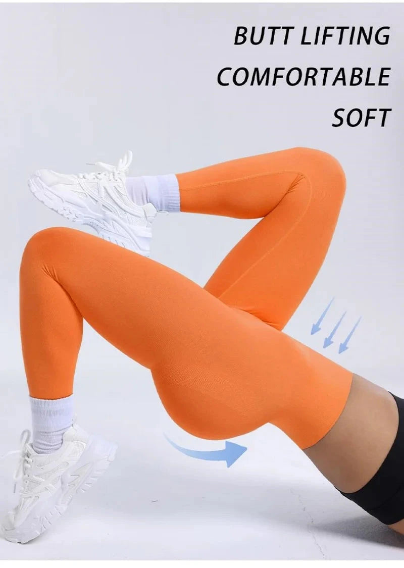 Women Fitness Solid Color Seamless Leggings High Waist Push in orange, showcasing butt lifting and soft compression fit for yoga and workouts