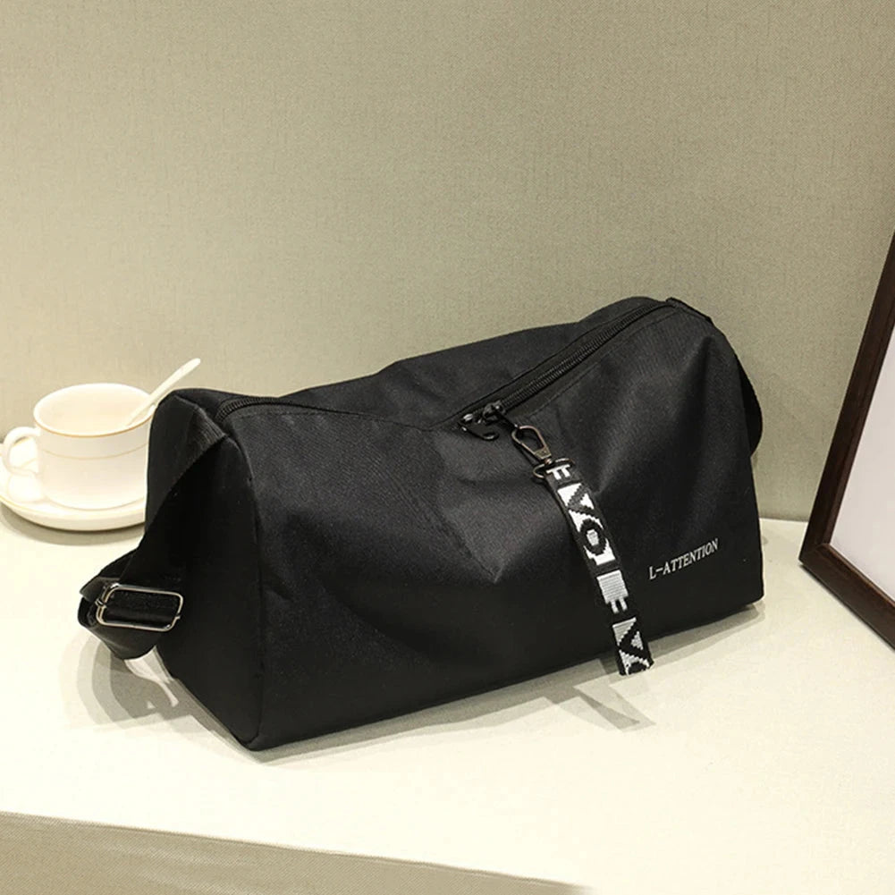 Stylish black multifunction gym handbag with side view showing durable nylon material and compact design for weekend training.
