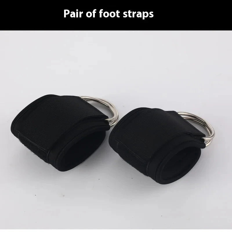 Adjustable black foot straps with double rings for gym equipment. Supports leg and buttocks workouts using gantry frame systems.