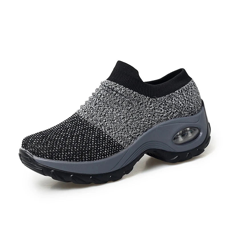 Women Sneakers Fashion Breathable Walking Mesh Platform Shoes in black with slip-on design and cushioned sole for gym or casual wear.