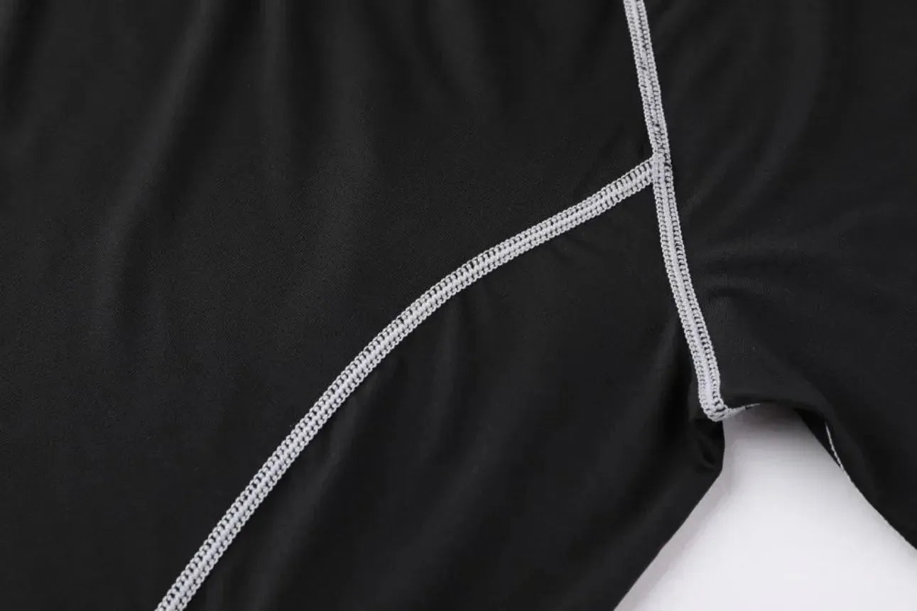 Detailed stitching on black Men Bodybuilding Sportswear Clothes Fitness Suit, highlighting quality and durability for workouts.