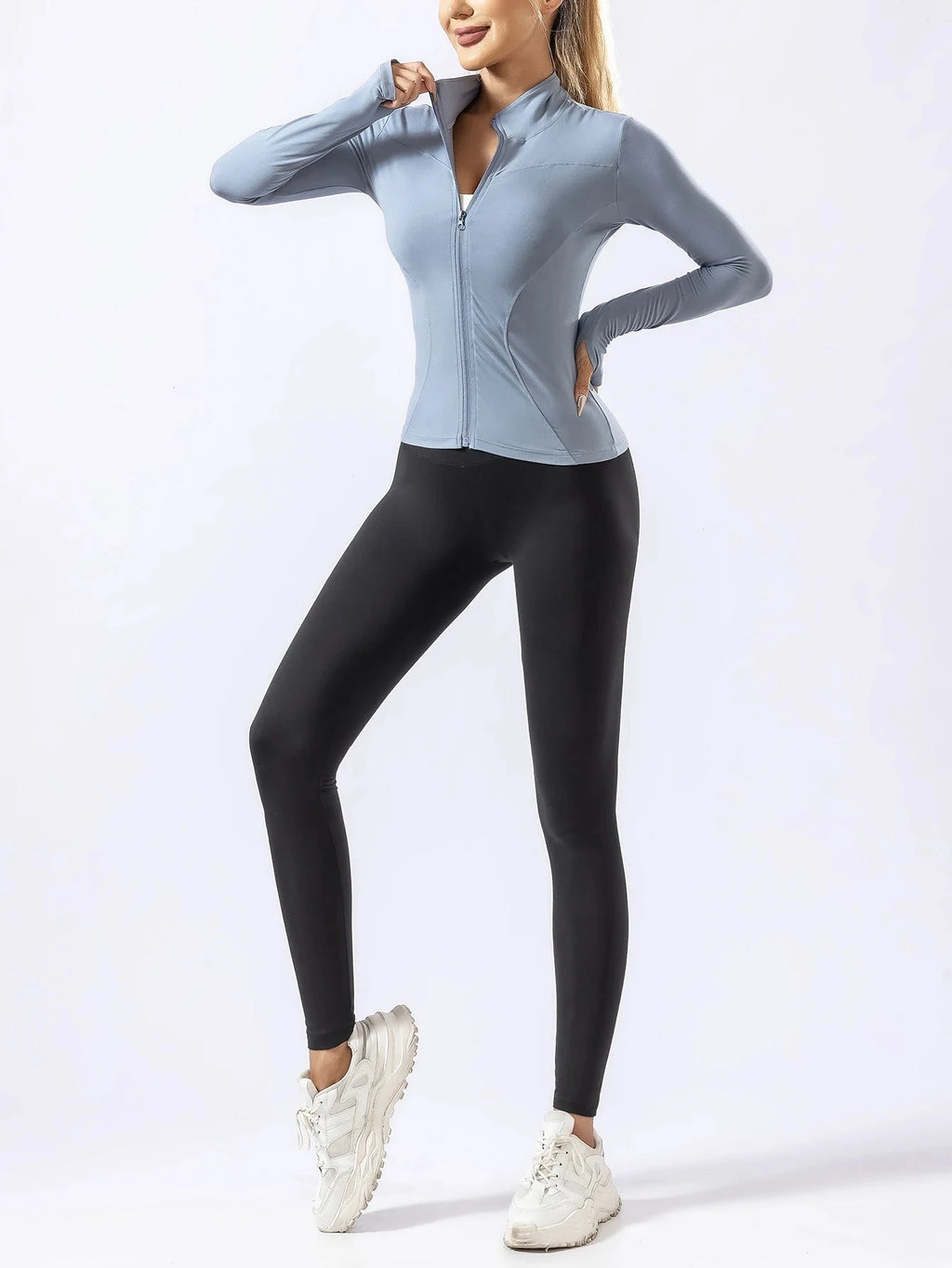Blue zip-up quick-dry yoga top with black leggings for women, designed for autumn and winter gym and running activities.