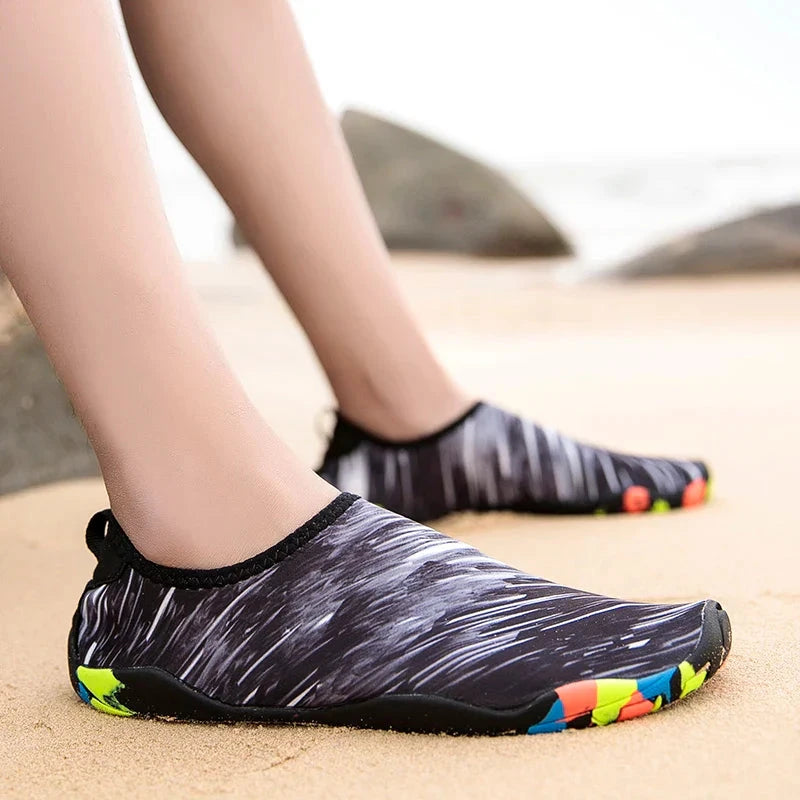 Unisex quick-drying beach aqua shoes for sports, featuring a slip-on design and colorful outsole, perfect for outdoor activities.