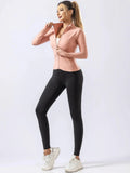 Pink zip-up quick-dry yoga top with black leggings for women, perfect for autumn and winter gym, running, and fitness routines.