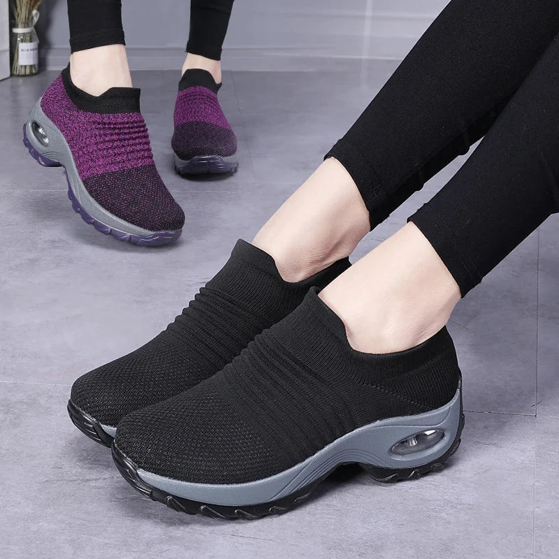 Women Sneakers Fashion Breathable Walking Mesh Platform Shoes in black with slip-on design and cushioned sole for gym or casual wear.