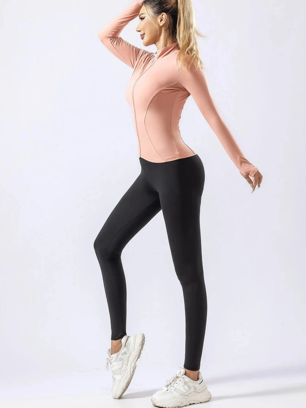 Pink fitted yoga top with black leggings for women, featuring quick-dry fabric for autumn and winter gym or running sessions.