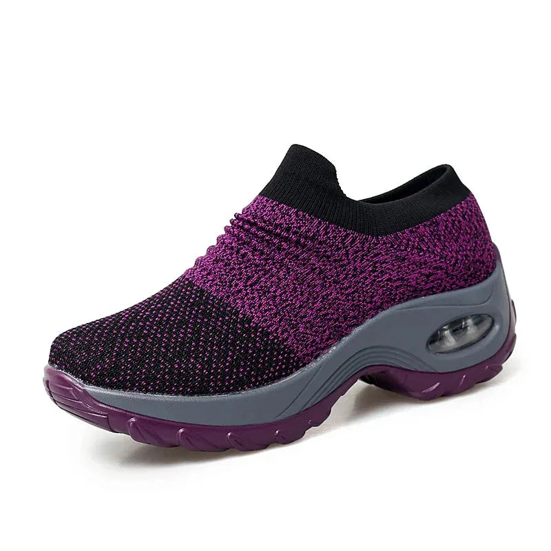 Women Sneakers Fashion Breathable Walking Mesh Platform Shoes in black with slip-on design and cushioned sole for gym or casual wear.