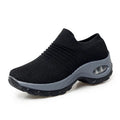 Women Sneakers Fashion Breathable Walking Mesh Platform Shoes in black with slip-on design and cushioned sole for gym or casual wear.